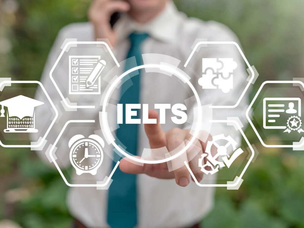 IELTSの文字を指さす男性